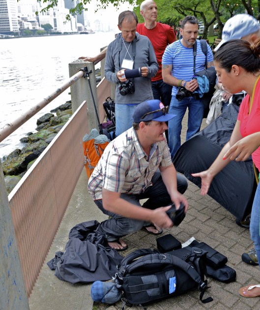 Mentor Lucas Gilman unloads camera gear on Roosevelt Island for outdoor shoot.