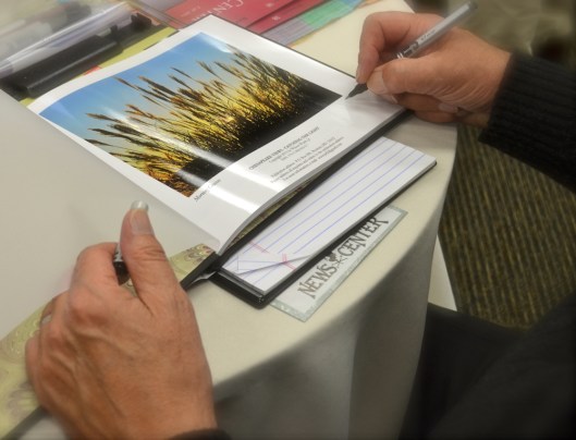 Signing "Chesapeake Views - Catching the Light" - Photo by Katie Wyatt